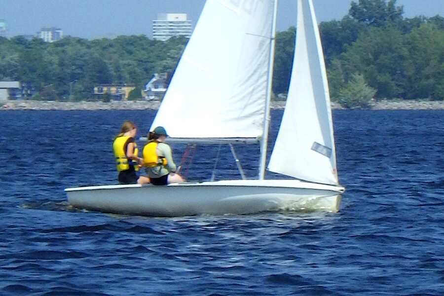 Two sailors racing a Club 420 dinghy